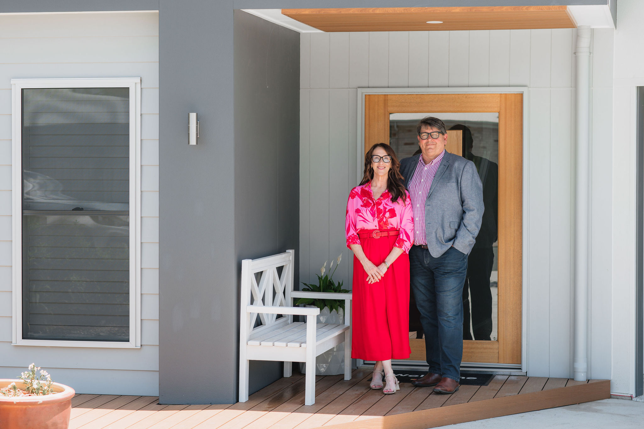Lissa HOlgate & Rob English Portrait, standing on front porch of home. 
